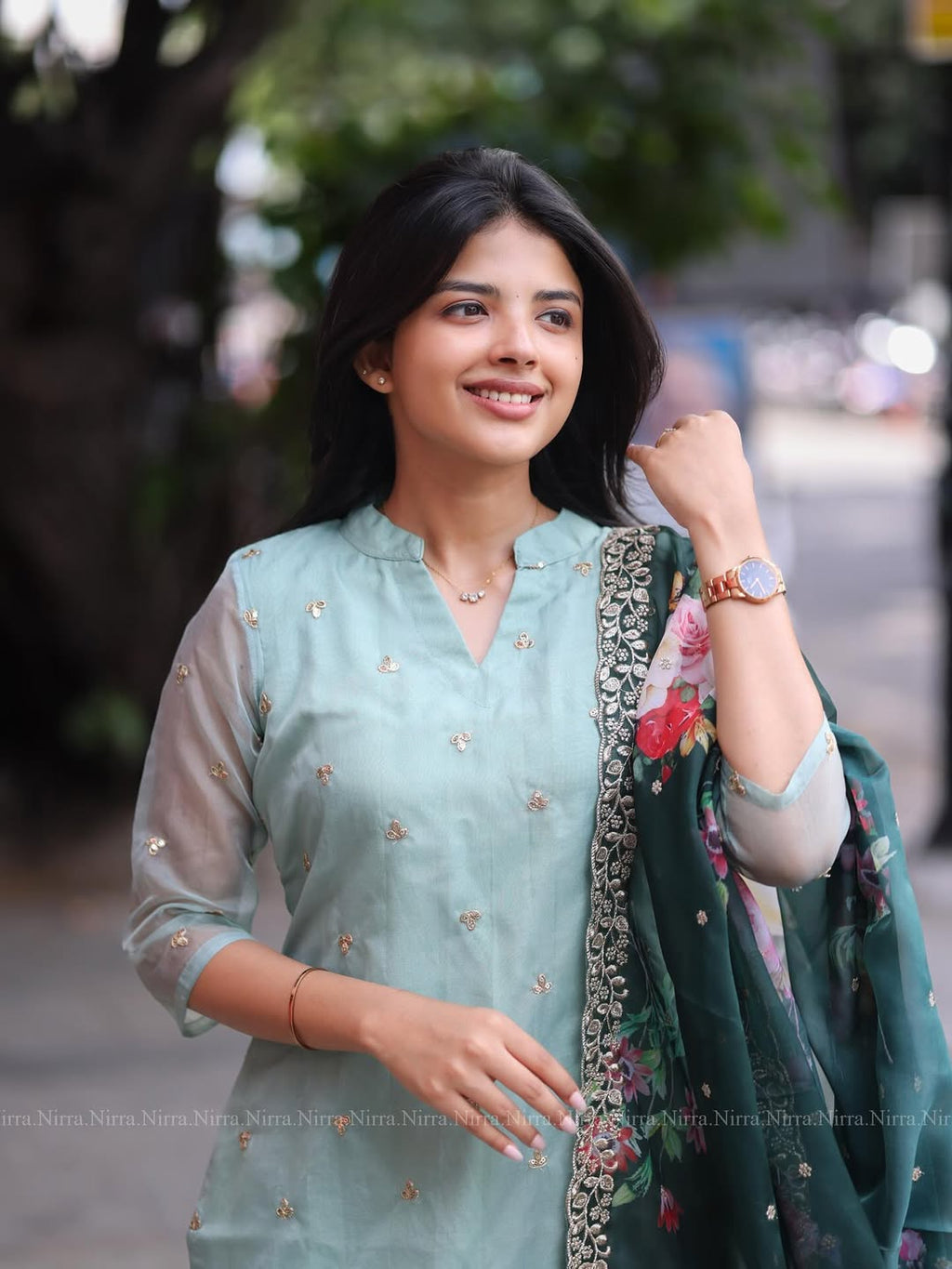 Flaunt in our turquoise green organza top paired with floral shawl salwar set