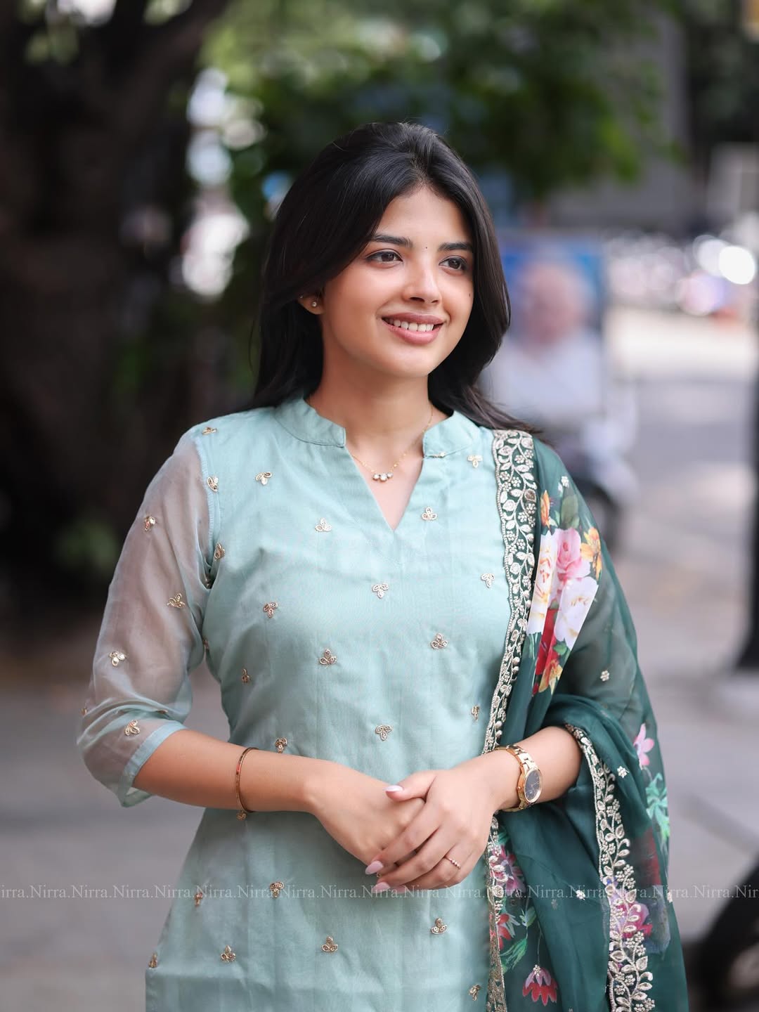 Flaunt in our turquoise green organza top paired with floral shawl salwar set