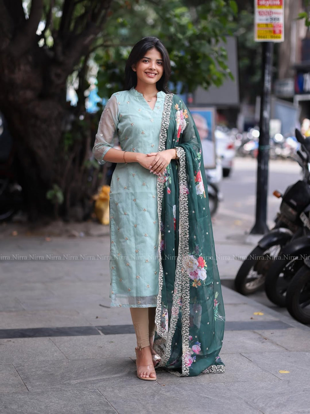 Flaunt in our turquoise green organza top paired with floral shawl salwar set