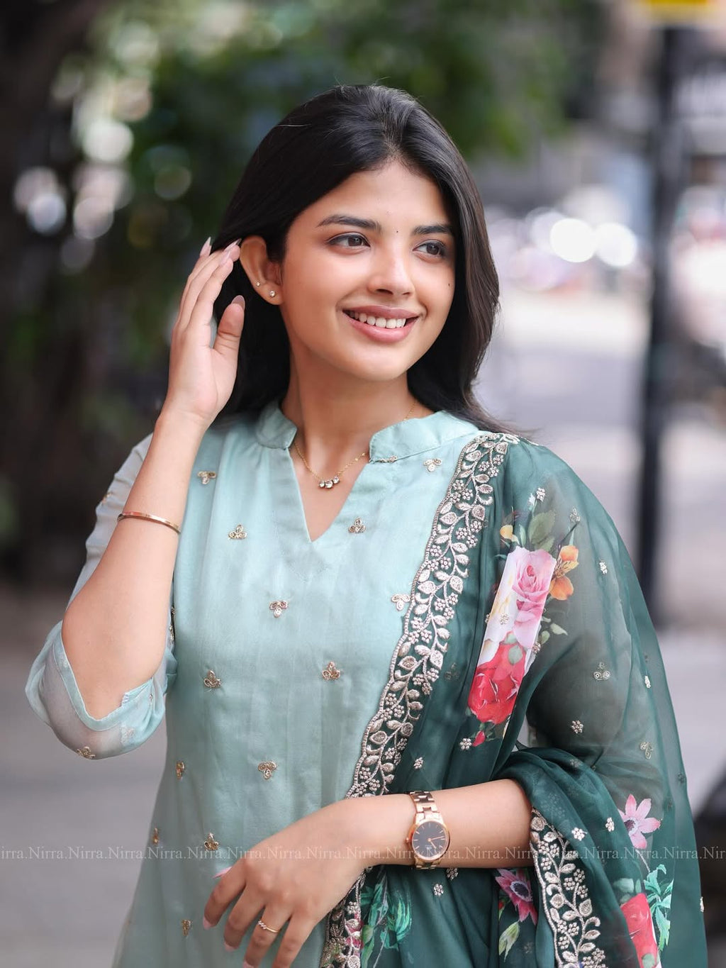 Flaunt in our turquoise green organza top paired with floral shawl salwar set